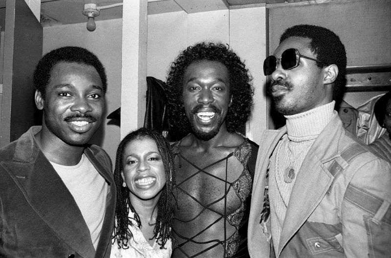 George Benson, Valerie Simpson, and Nickolas Ashford of Ashford & Simpson pose backstage with Stevie Wonder in New York, 1978