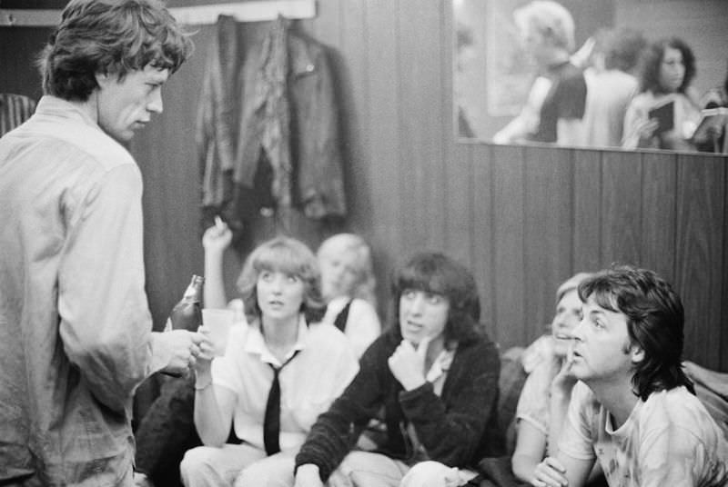 Paul and Linda McCartney (right) backstage with Mick Jagger (left) and Bill Wyman (centre) at a Rolling Stones concert at The Palladium, New York City, June 19, 1978