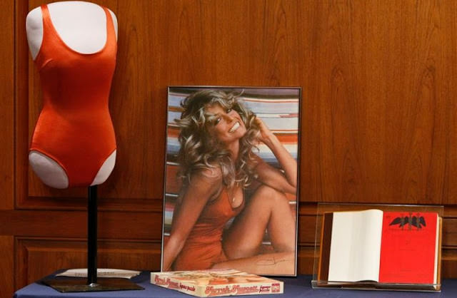 In 2011, two years after her death, her husband, Ryan O'Neil, donated the iconic red swimsuit and a copy of her poster to the Smithsonian National Museum of American History.