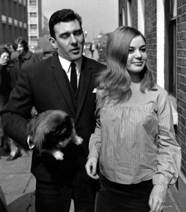 Reggie Kray and Frances Shea outside the Kray home in Valance Road after he and Ronnie are acquitted of all charges of demanding money with menaces, 5th April 1965