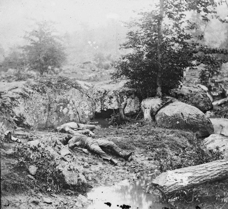 Dead Confederates lie in the area known as the "slaughter pen" near Little Round Top.