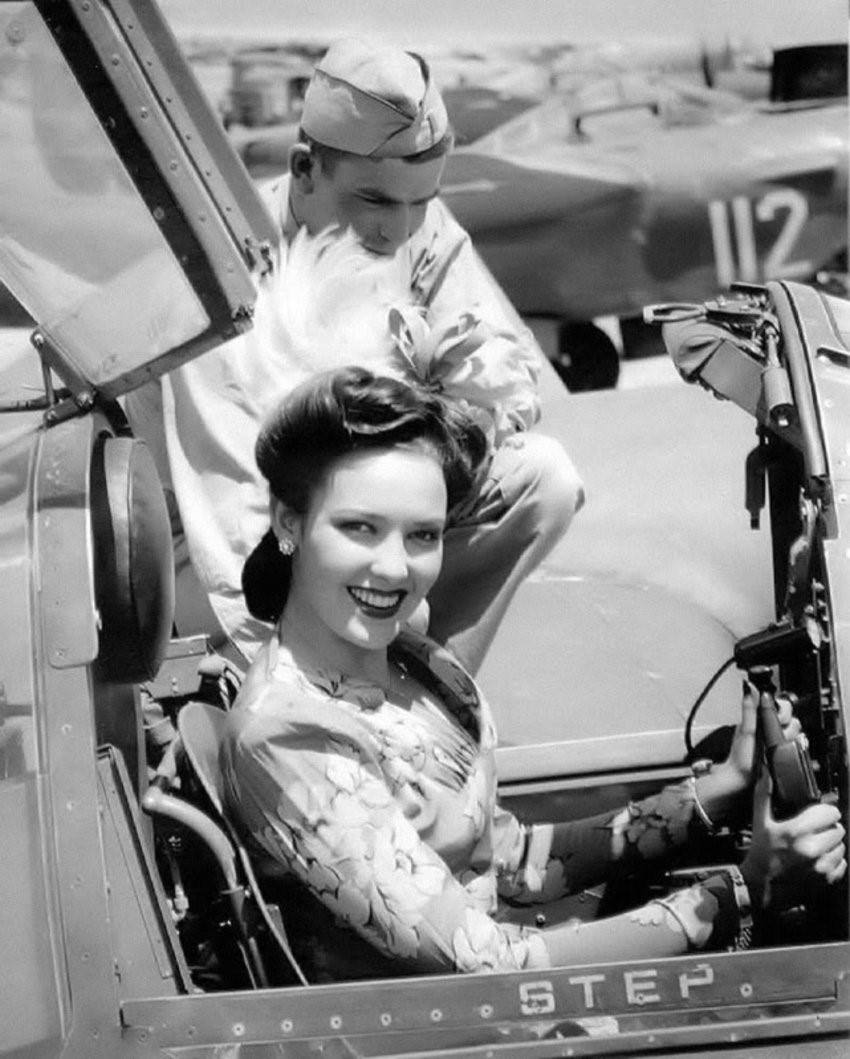 Linda Darnell sitting in Cockpit