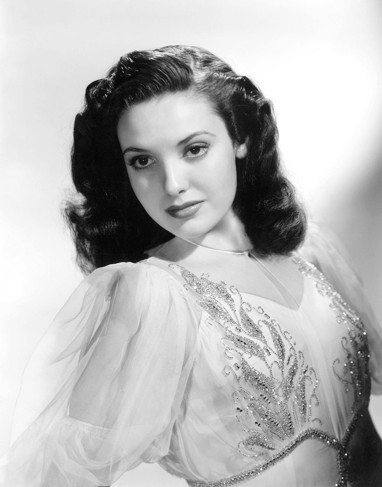Linda Darnell, 1940, wearing a gown by Travis Banton
