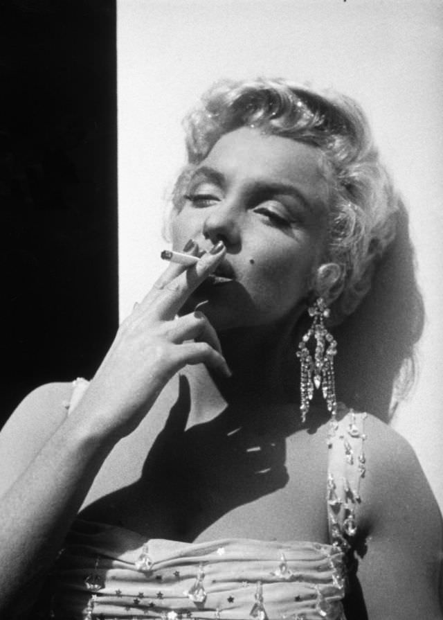 Marilyn Monroe Taking A Cigarette Break During The Filming Of “There’s No Business Like Show Business” 1954