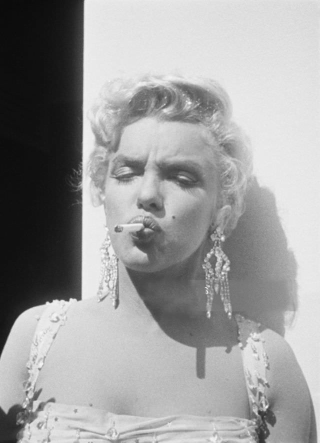 Marilyn Monroe Taking A Cigarette Break During The Filming Of “There’s No Business Like Show Business” 1954