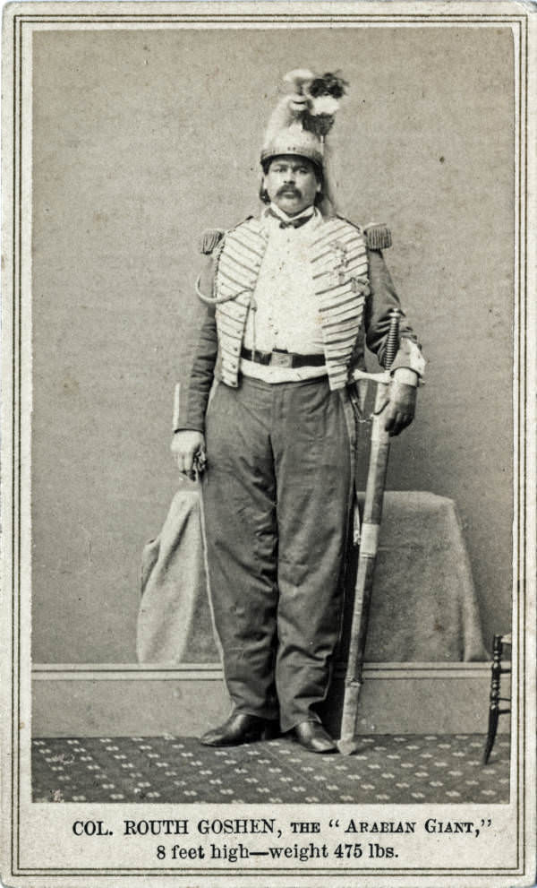 Colonel Routh Goshen, known as the Arabian Giant, poses in a photo studio for a publicity shot, 1865