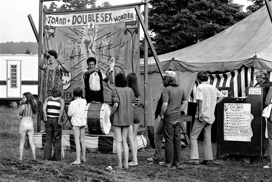A traveling circus sideshow attracts customers to see "JoAnn the Doublesex Wonder" during a stop in the small town of Abingdon, Virginia, 1967