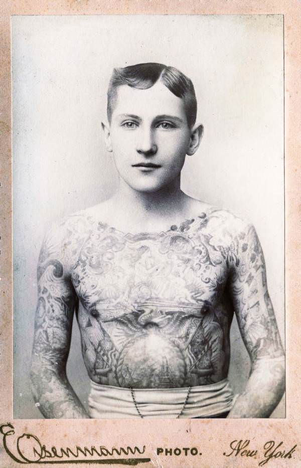 Cabinet photograph of a young man with his entire chest and arms tattooed, New York, New York, 1890