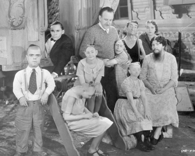 Director Tod Browning poses with cast members from his film Freaks, 1932