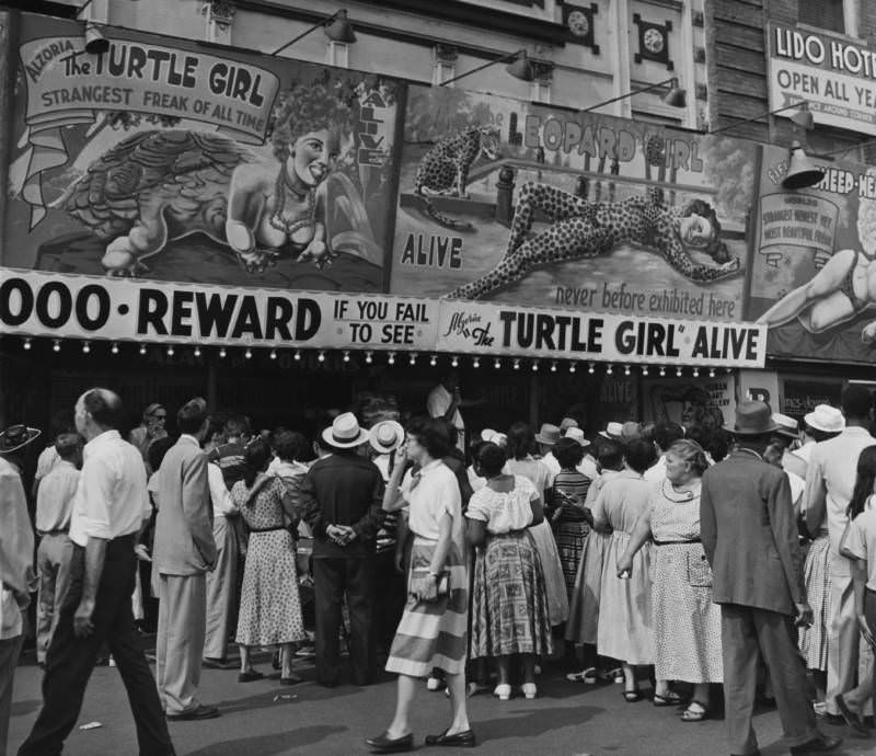 People standing in line to see a "freak" show in Coney Island