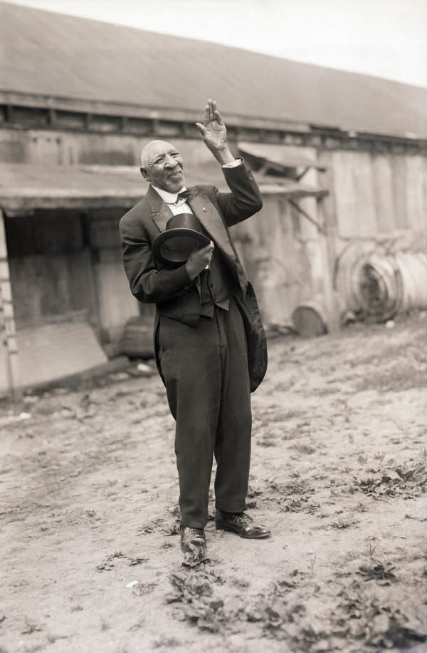 Portrait of Zip the "freak" standing on the beach at Coney Island, 1925