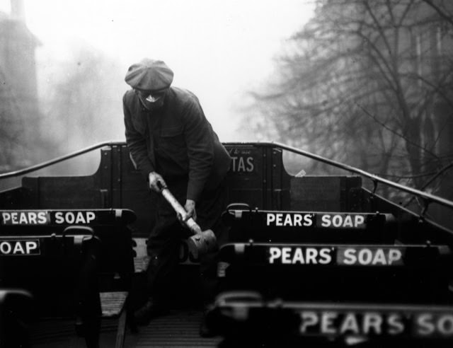 A man prepares 'anti-flu' spray for buses of the London General Omnibus Co. London, March 2, 1920.