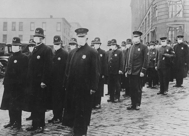 Seattle policemen wear protective gauze face masks during the influenza epidemic, 1918.