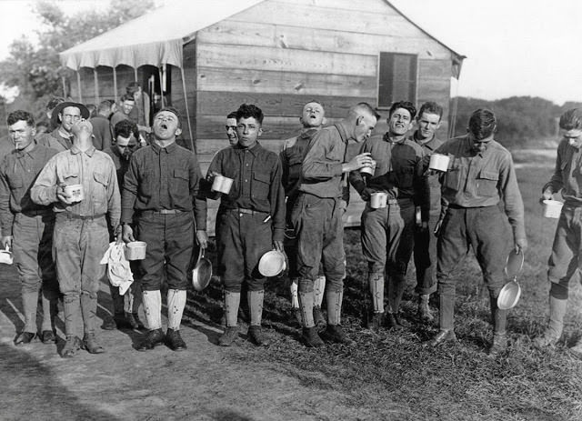 Soldiers gargle with salt water to prevent influenza on September 24, 1918, at Camp Dix, New Jersey.
