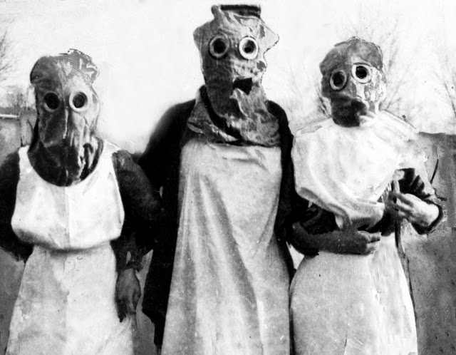 British Red Cross nurses close to the front line in Flanders, wearing their gas masks, against the threat of German gas attacks.