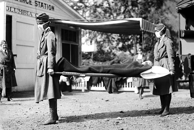 Red Cross nurses and a patient at the Red Cross Emergency Ambulance Station in Washington, DC, 1918.