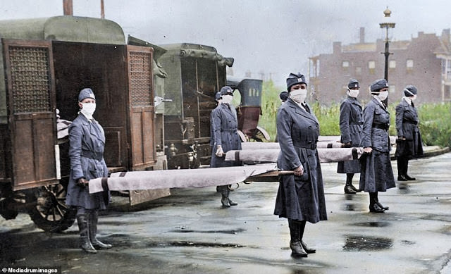 Red Cross surgeons pick up stretchers to help treat the ill in St Louis during the Spanish flu pandemic.