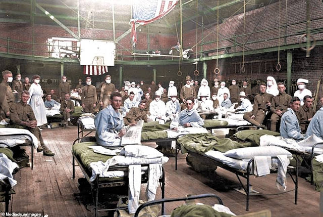 Old gymnasium filled with troops returning home from World War One re-used as an emergency Spanish Flu hospital.