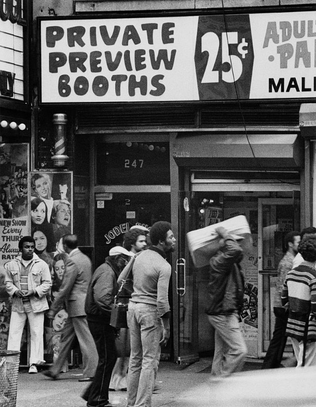 A sign offers 'Private Preview Booths' at a peep show, New York City, circa 1978.