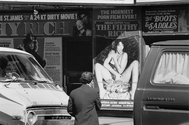 An exterior view of a cinema which is showing the adult film 'The Filthy Rich', New York City, 1982.