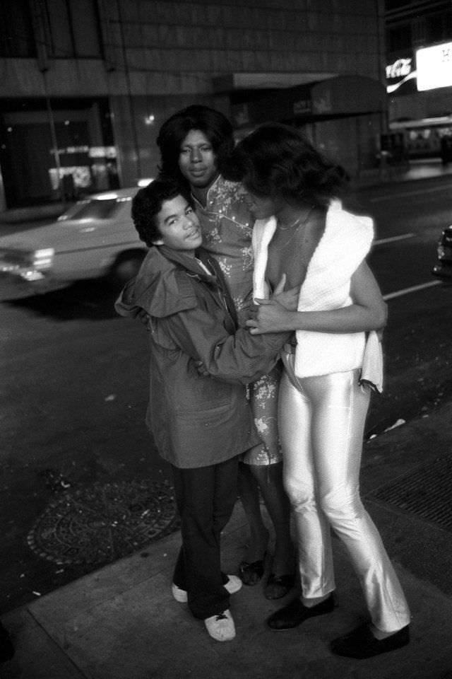 A teenage hustler fooling around with two transvestites.