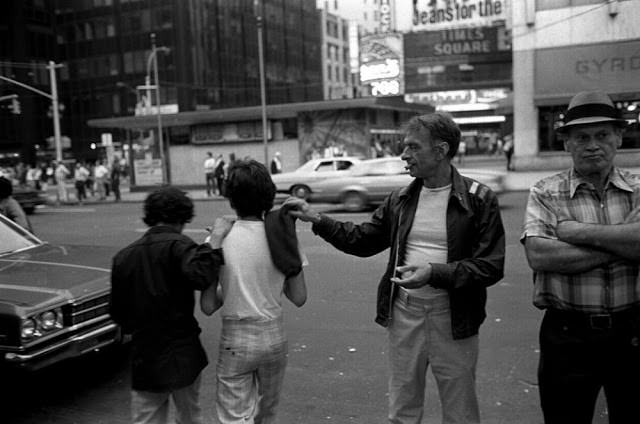 Hustlers (center) and chicken hawks in Times Square.