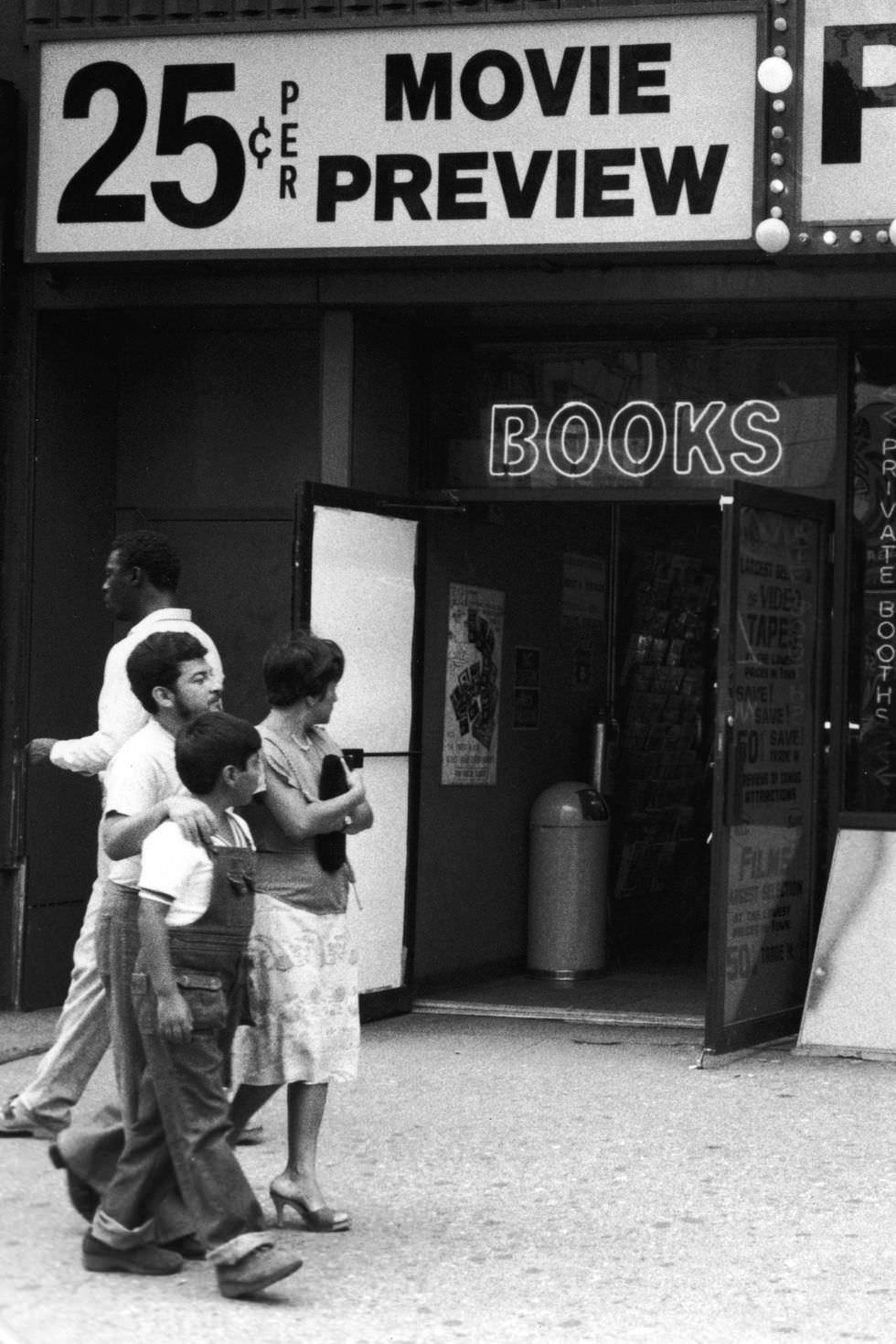 A family walks by "the world's largest selection" of live nude girl models in 1970.