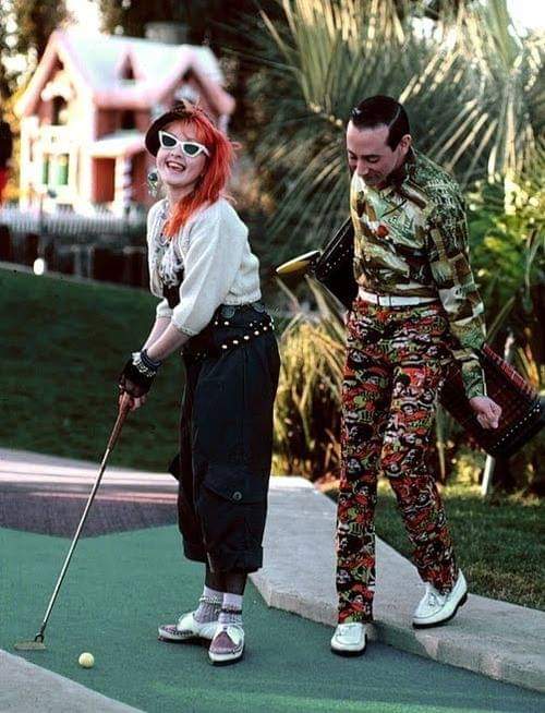 Cyndi Lauper and Peewee herman playing golf 1980s