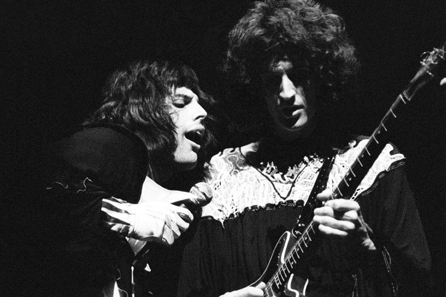 Freddie Mercury with bandmate Brian May, on stage in the UK