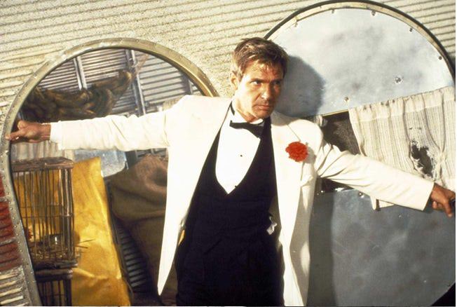 Young Harrison Ford Wearing Tux with Red Flower