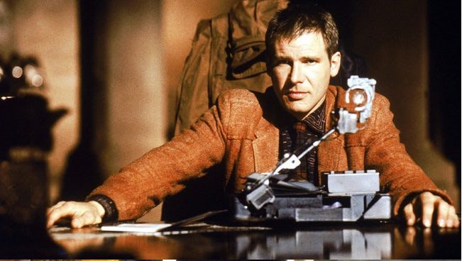 Young Harrison Ford Wearing Orange Coat