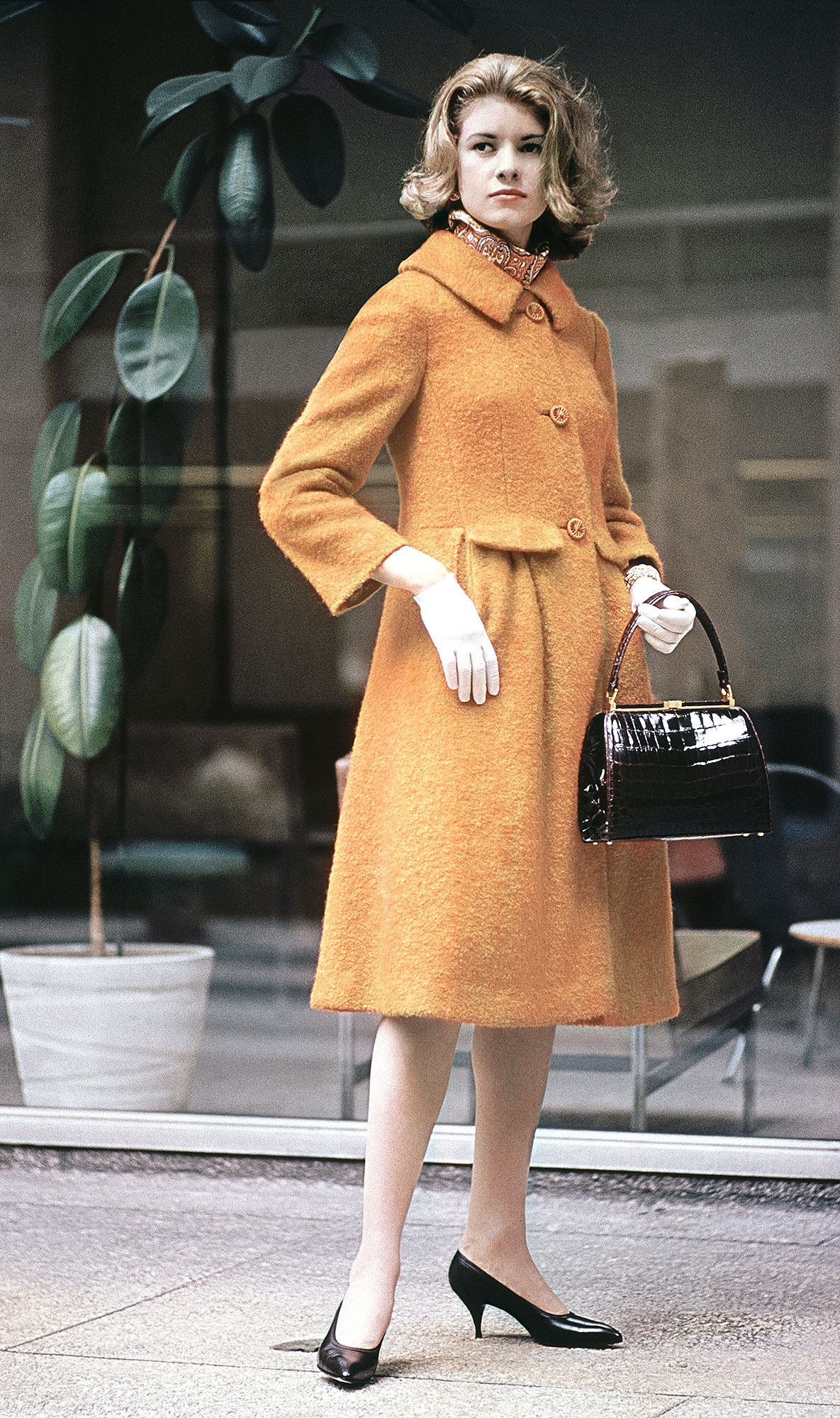 Martha Stewart sitting sideways on a chair, 1970