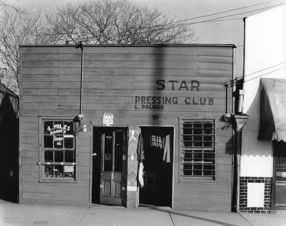 Vicksburg Negroes and shop front, May 1936