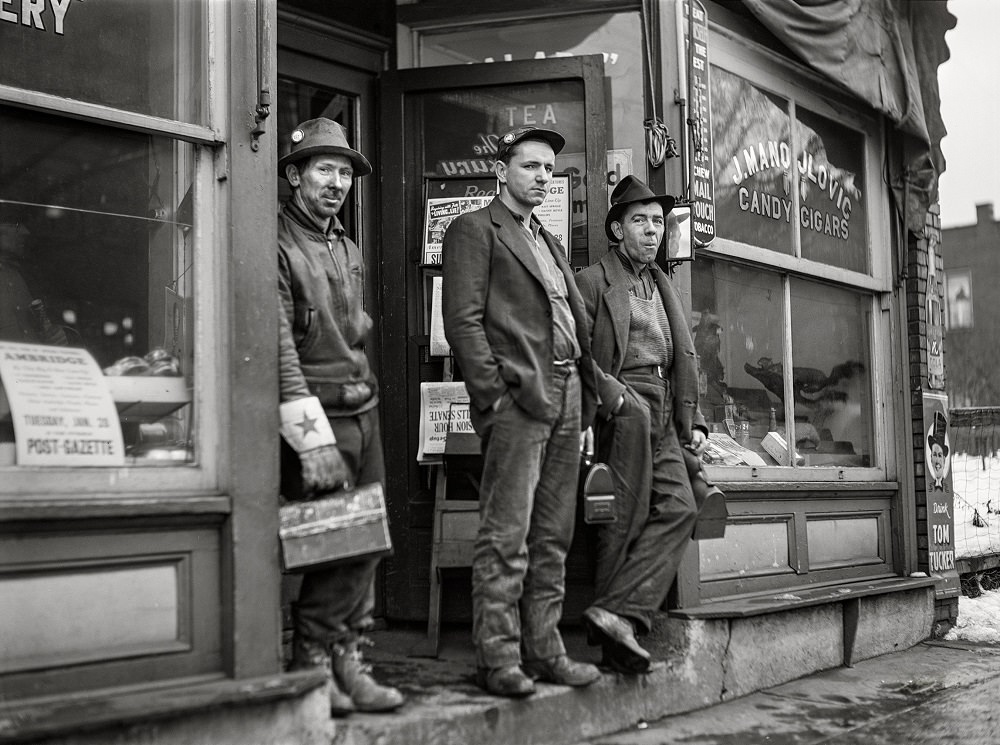 Employees of American Bridge Company (United States Steel) waiting for the bus, Ambridge, Pennsylvania, January 1941