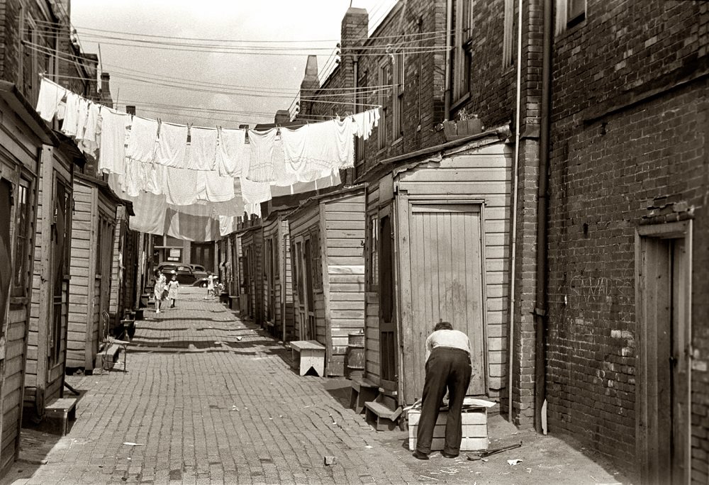 Back alley showing housing conditions in Ambridge, Pennsylvania, July 1938
