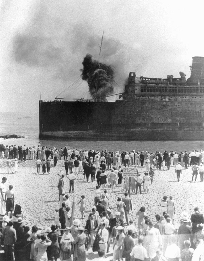 Onlookers watch as smoke billows from the Morro Castle off Sixth Avenue in Asbury Park, 1934