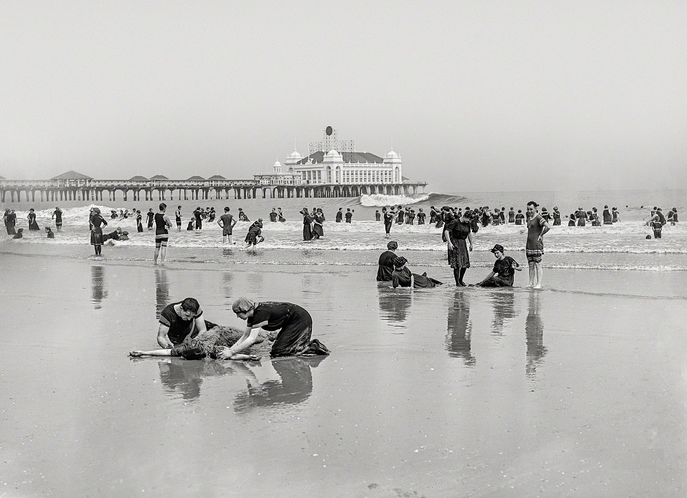 Beach bathers and Steel Pier, Atlantic City, New Jersey, circa 1905