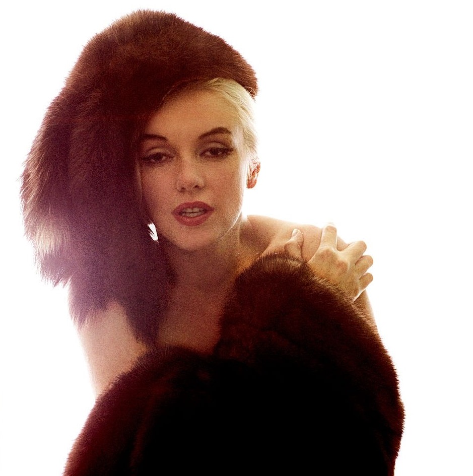 Marilyn Monroe wearing a fur hat and shawl, in Beverly Hills, California, 1962