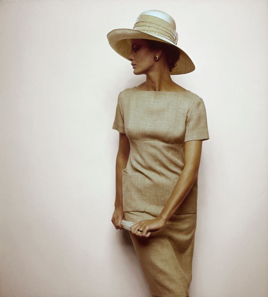 Model wearing tawny linen, short sleeve dress, Vogue 1963