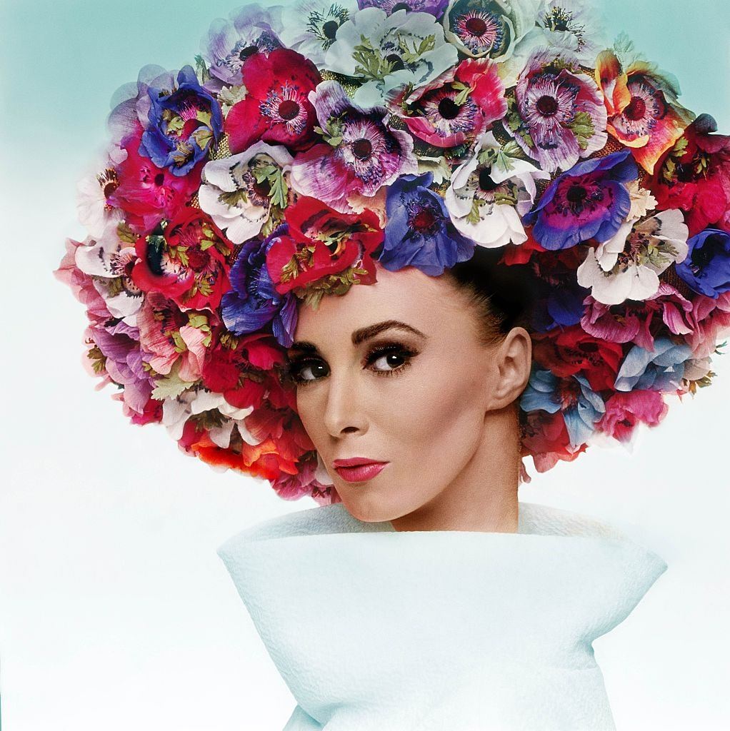 Model Wilhelmina in Dior hat of fabric anemones, Vogue 1964