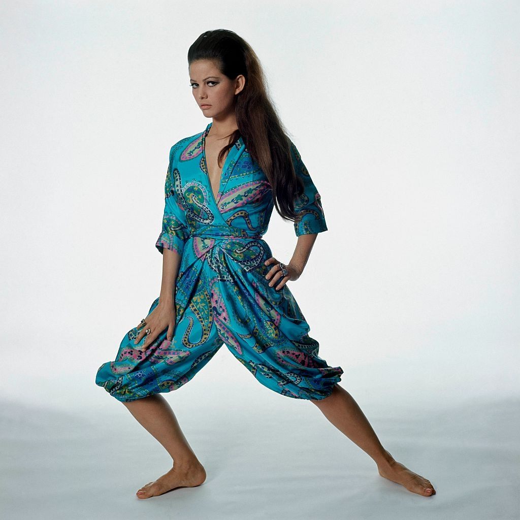 Actress Claudia Cardinale wearing a Paisley-print pajama set, Vogue 1965