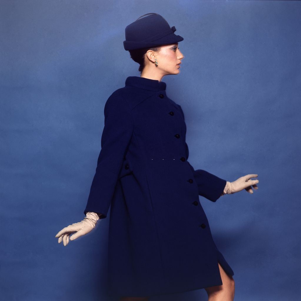 Model and actress Marisa Berenson in a Jacques Tiffeau for Tiffeau & Busch wool smock coat, Vogue 1965