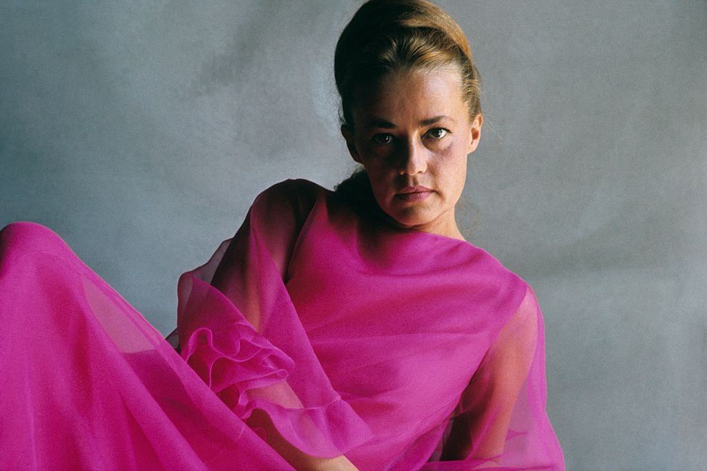 French actress Jeanne Moreau wearing a chiffon gown, Vogue 1965