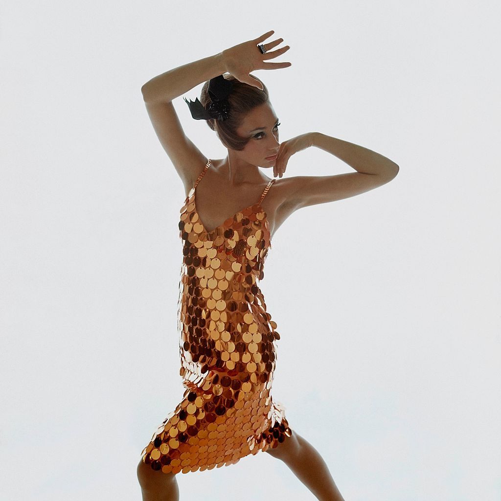Model Marisa Berenson wearing copper-colored sequin dress, Vogue 1966