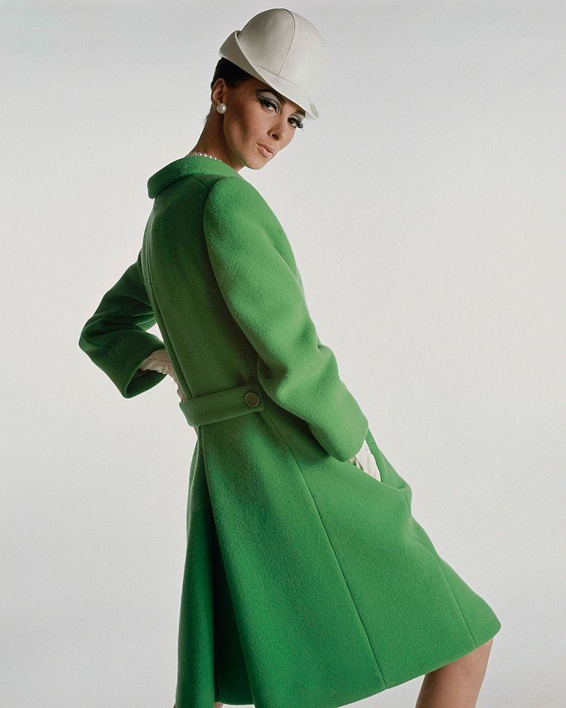 Model wearing green wool belted coat, Vogue 1966