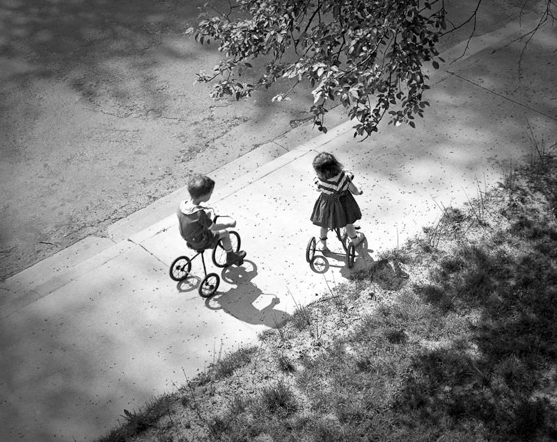 Kids riding tricycles, May 1939
