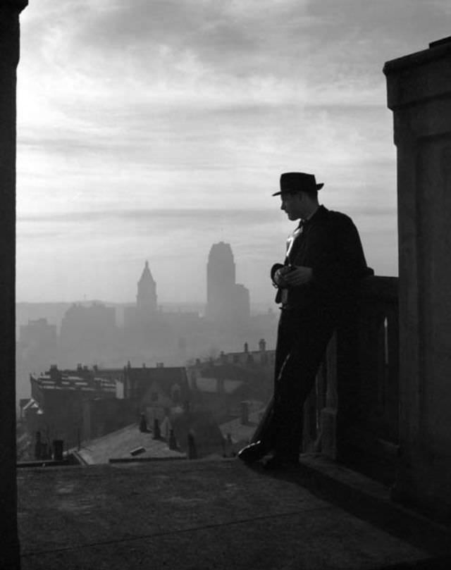 Young man contemplates downtown Cincinnati's skyline, Feb. 11th, 1938