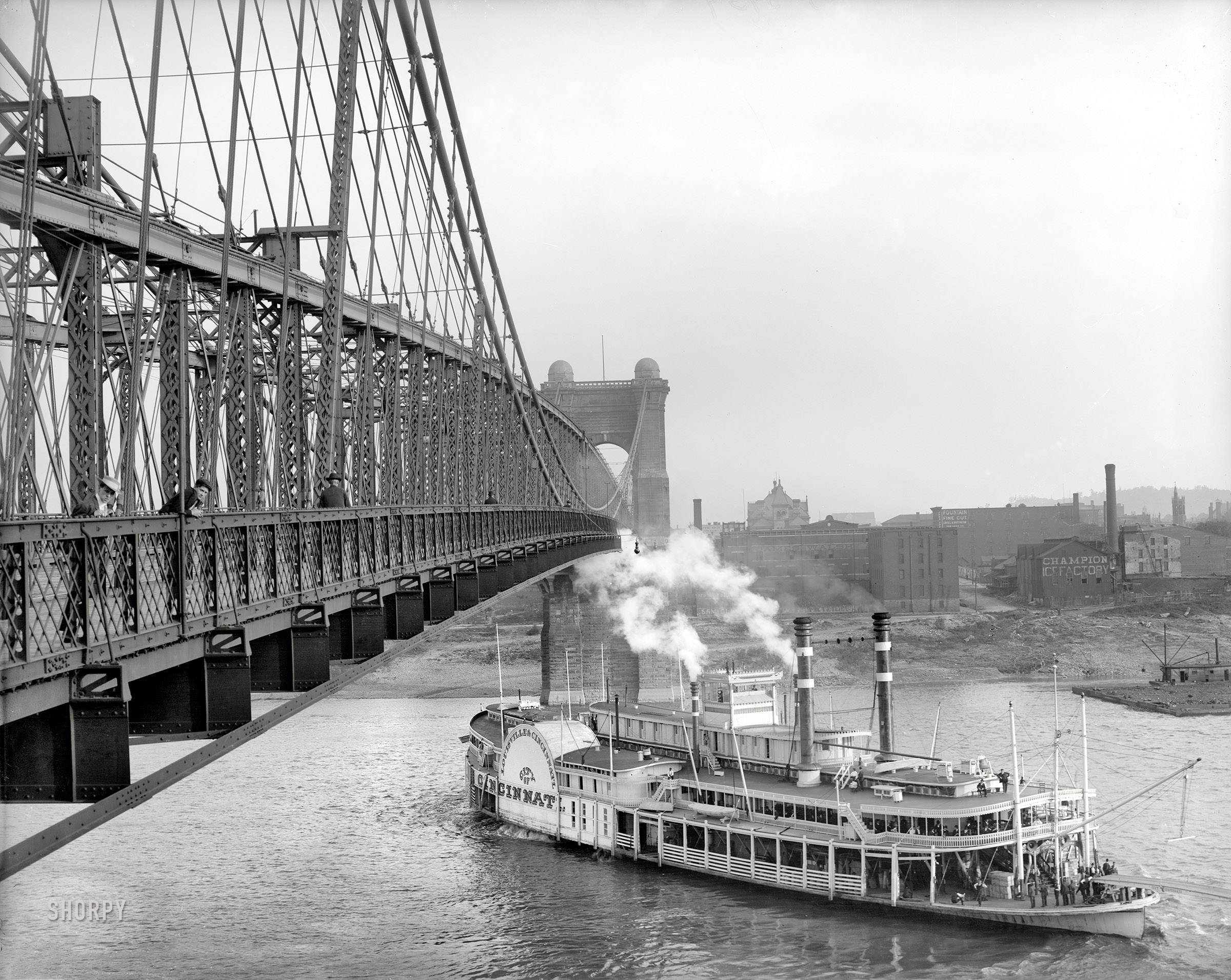 The sidewheeler Cincinnati passing under the Roebling Suspension Bridge, Cincinnati, 1906