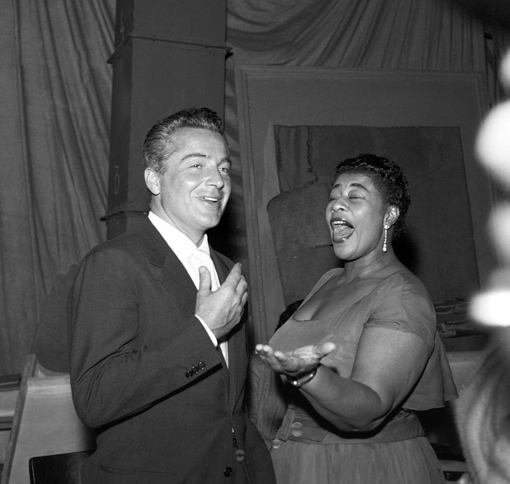 Ella Fitzgerald singing with Rossano Brazzi during her concert at Adriano Theatre. Rome, 31st May 1957