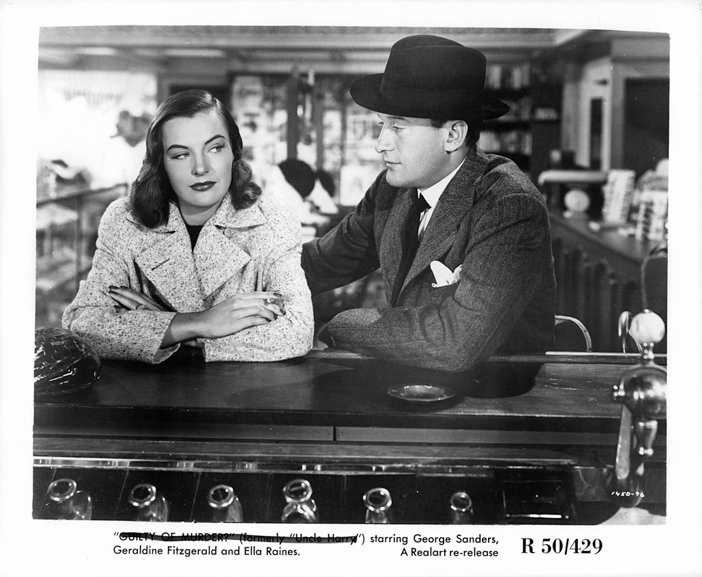 Ella Raines and George Sanders sitting at bar in a scene from the film 'The Strange Affair Of Uncle Harry', 1945.